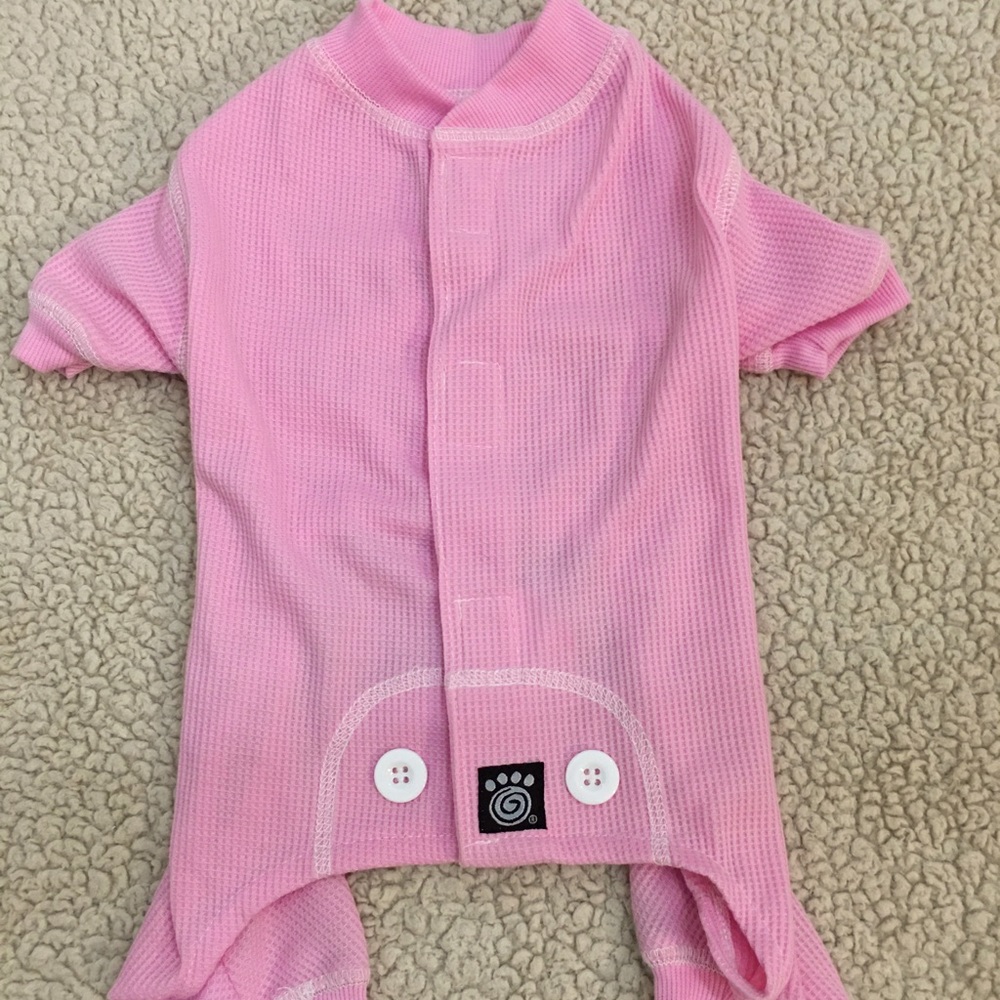 One pair PETRAGEOUS puppy pajamas.  There pink for your Princess. Size Small.